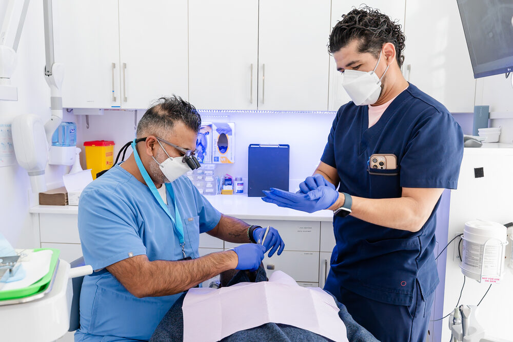 EmergDENT dentist and assistant at work
